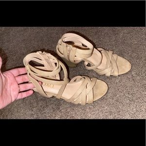 Tan heels, zip up on inside.